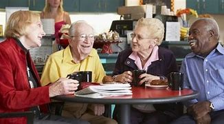 Group of older adults seated around a table