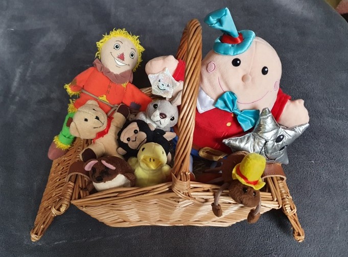 Selection of toys in wicker basket