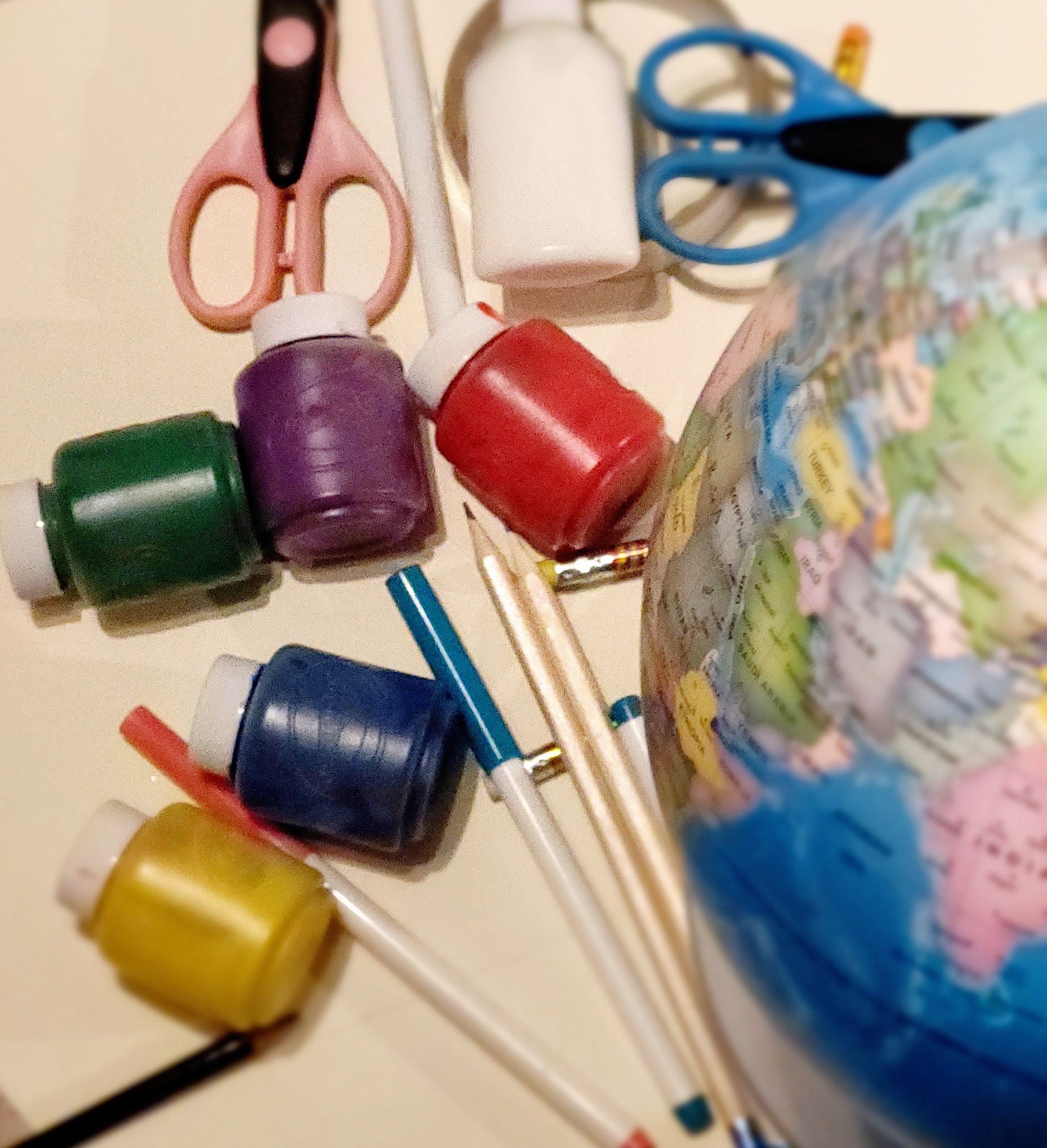 craft materials and a globe