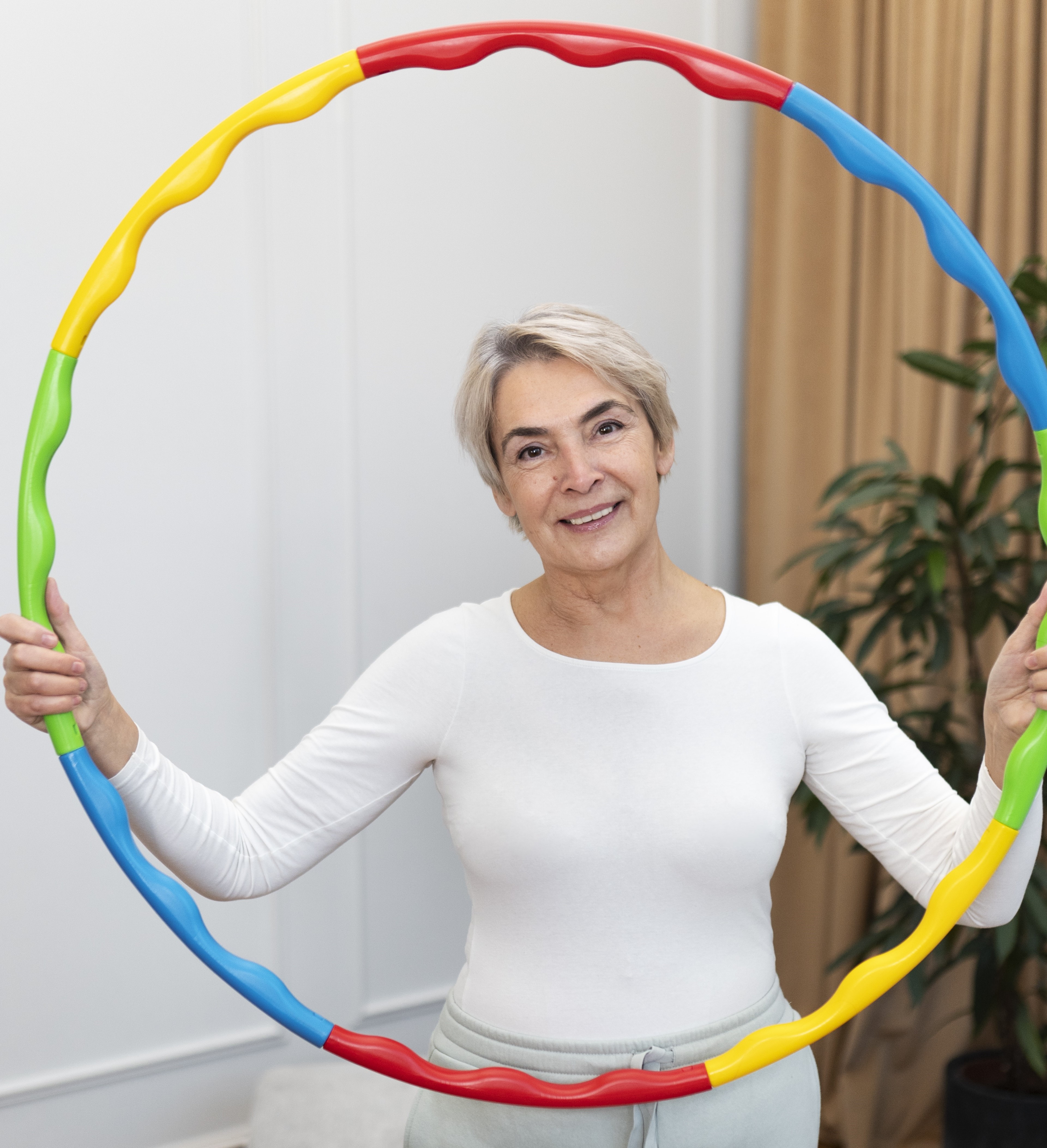 Person holding up a hula hoop in front of them