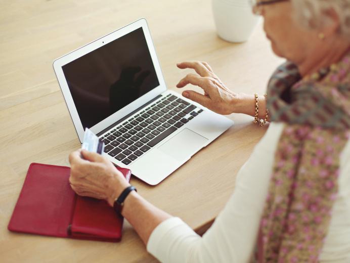 Older woman looking at laptop