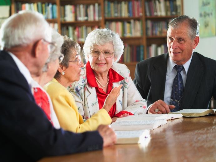 Older people reading together