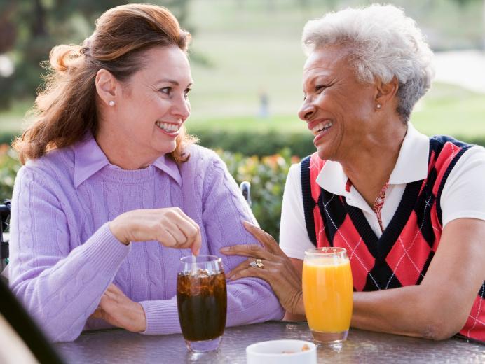 Carer chatting with older woman