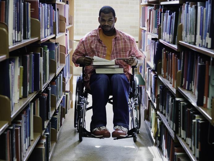 Man in wheelchair at library