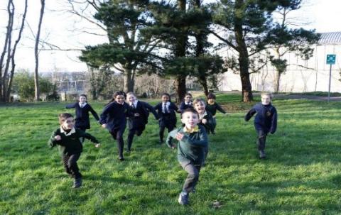 group of school children running