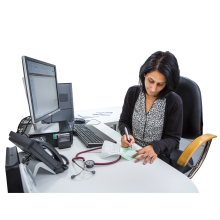 A GP at work at their desk