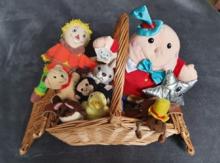 A wicker basket filled with soft toys