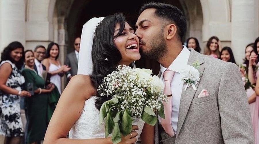 Married couple share a kiss outside Hendon Town Hall