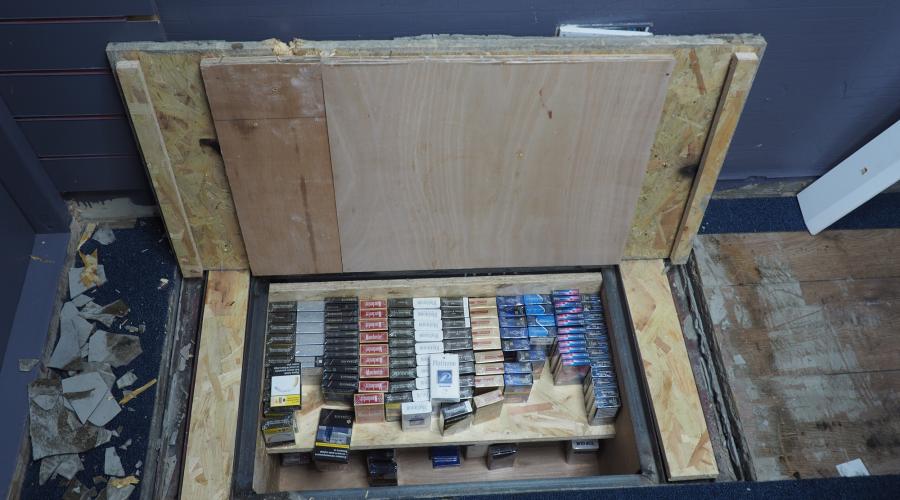One store installed a a sophisticated hydraulic lift beneath its flooring to hide illicit cigarettes.