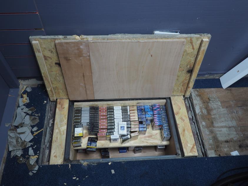 One store installed a a sophisticated hydraulic lift beneath its flooring to hide illicit cigarettes.