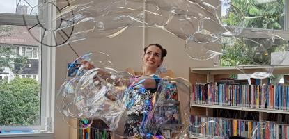 A lady making big bubbles